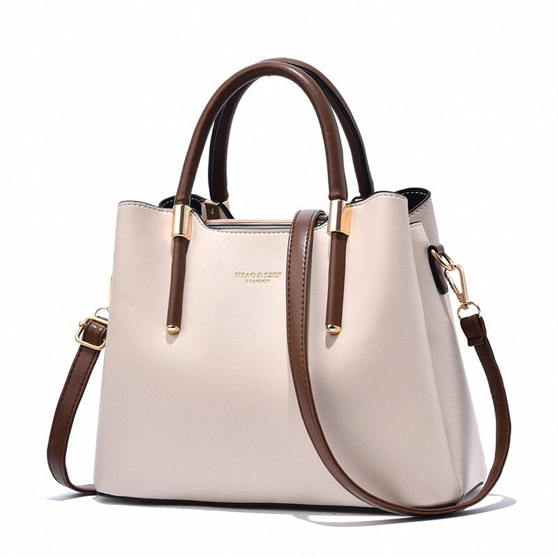 Elegant Cream Tote Handbag with Dual Brown Handles & Gold Hardware