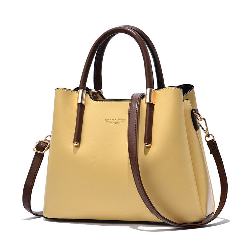 Elegant Cream Tote Handbag with Dual Brown Handles & Gold Hardware