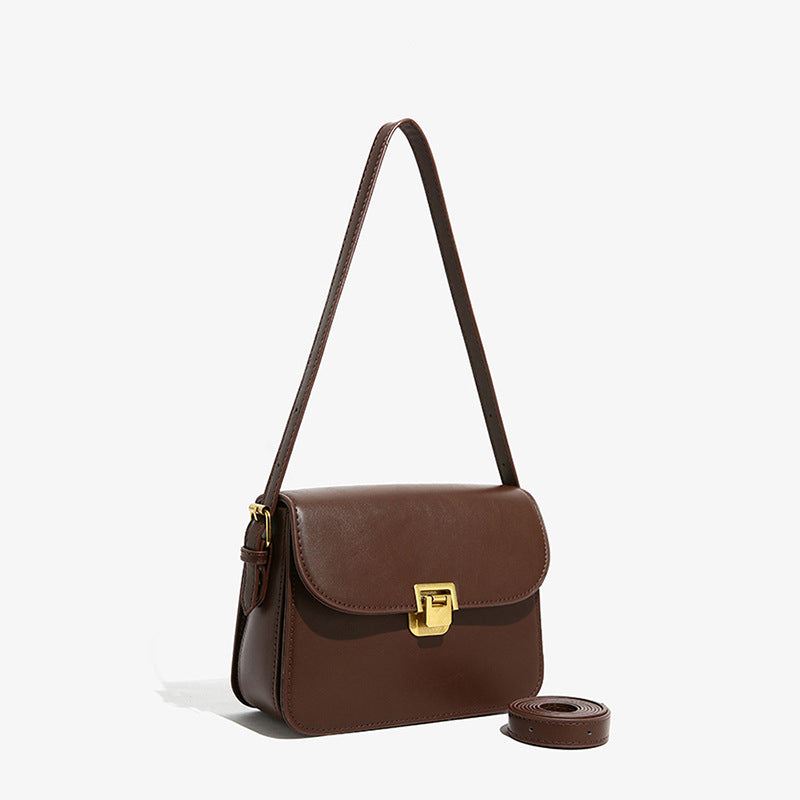 Elegant White Crossbody Bag with Gold Lock Closure