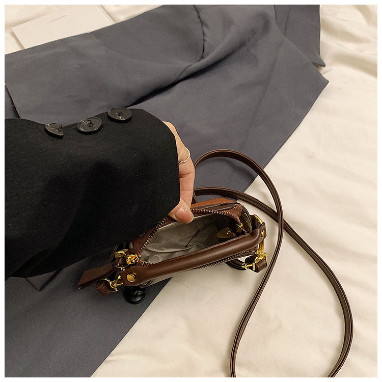 Classic Black Mini Top-Handle Crossbody Bag with Gold Hardware