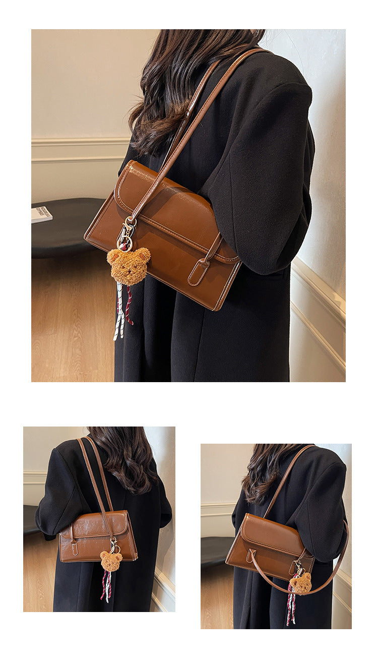 Classic Brown Shoulder Bag with Flap Closure and Teddy Charm
