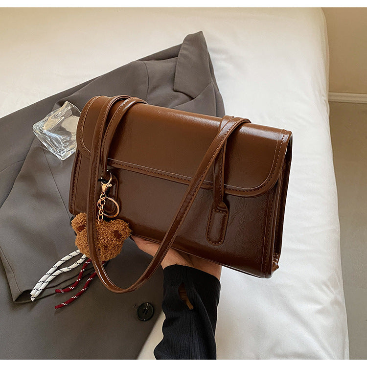 Classic Brown Shoulder Bag with Flap Closure and Teddy Charm