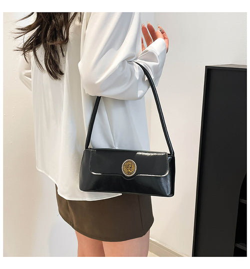 Classic Black Patent Shoulder Bag with Vintage Medallion Clasp