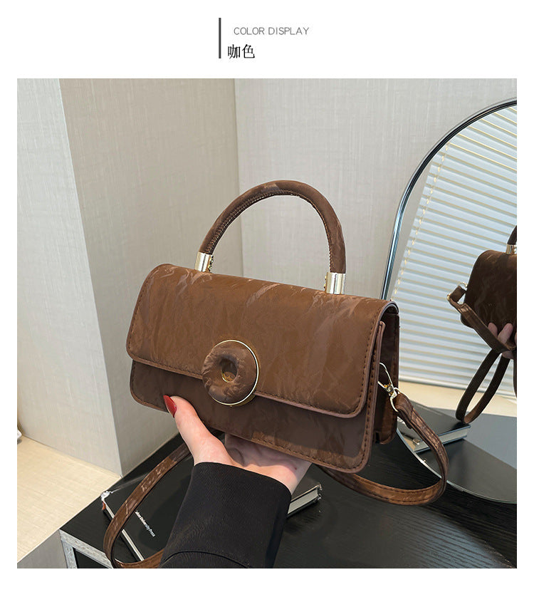 Elegant White Mini Top-Handle Bag with Circular Lock