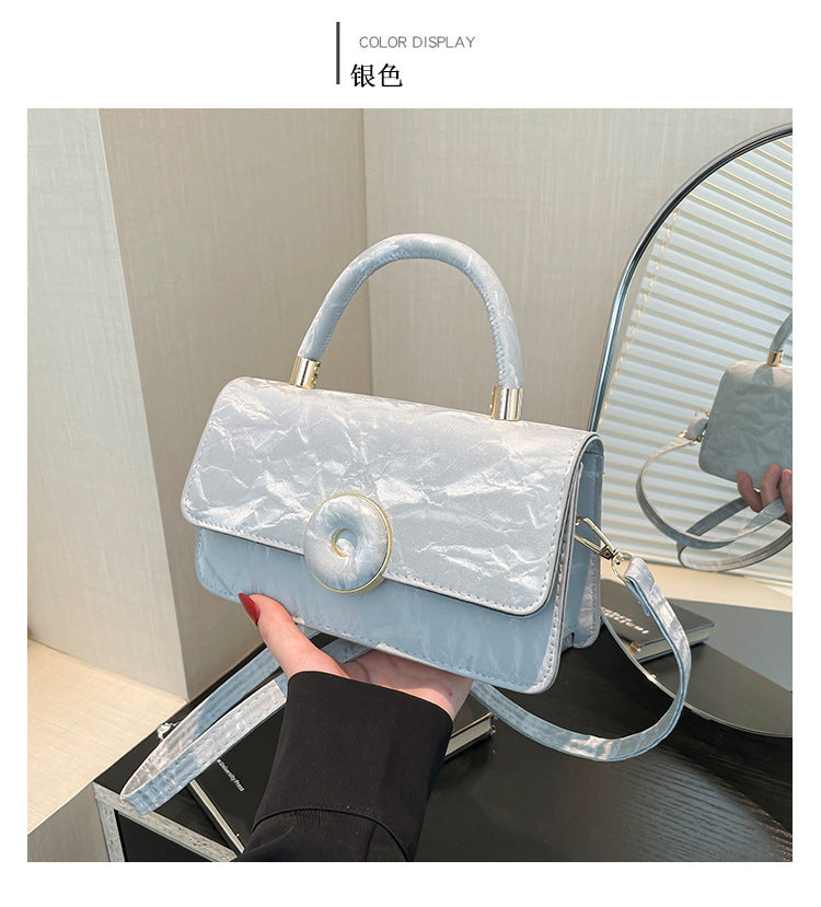 Elegant White Mini Top-Handle Bag with Circular Lock