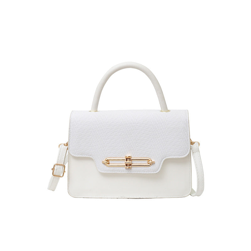 Elegant Black Leather Top-Handle Handbag with Gold Hardware